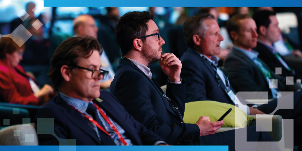 Image of professional white men at a conference