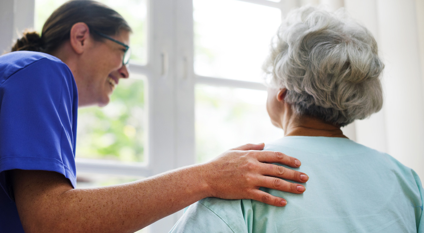Nurse Assisting Elderly Women
